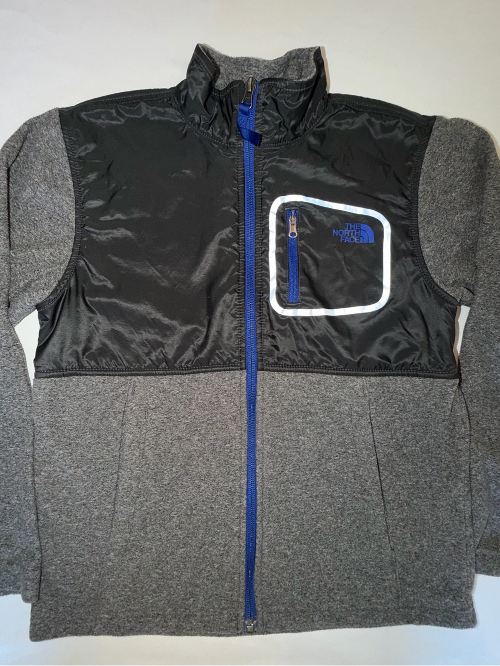 The North Face Kids Black and Gray Jacket with Blue Zip. C13,EMP